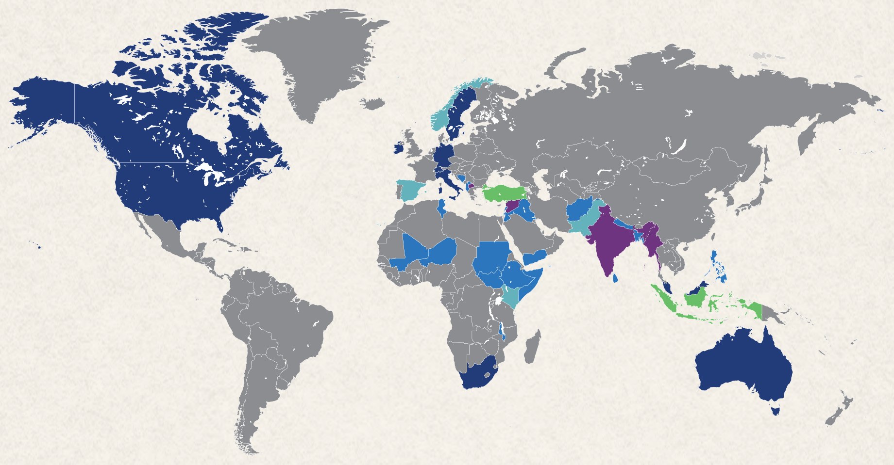 A world map with the countries where the Islamic Relief family works shaded in blues, greens and purples, and all other countries in grey.